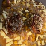 Pork Chops with butternut squash and apples in pan